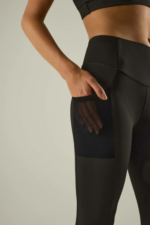 Leggings deportivo efecto vientre plano bolsillos laterales negro